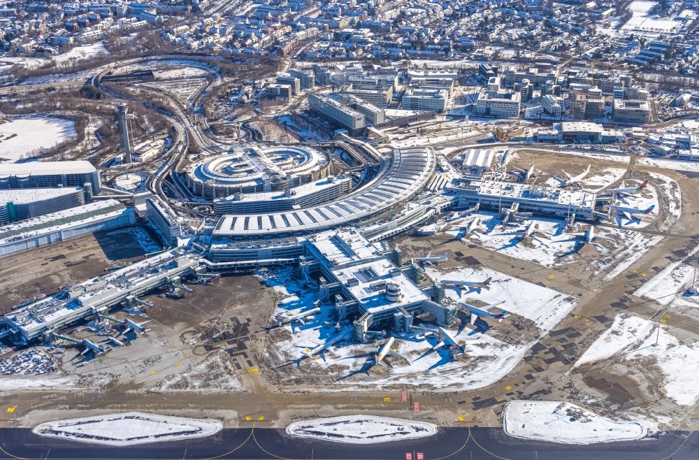 Düsseldorf from above - Wintry snowy dispatch building and terminals on the premises of the airport in Duesseldorf in the state North Rhine-Westphalia, Germany