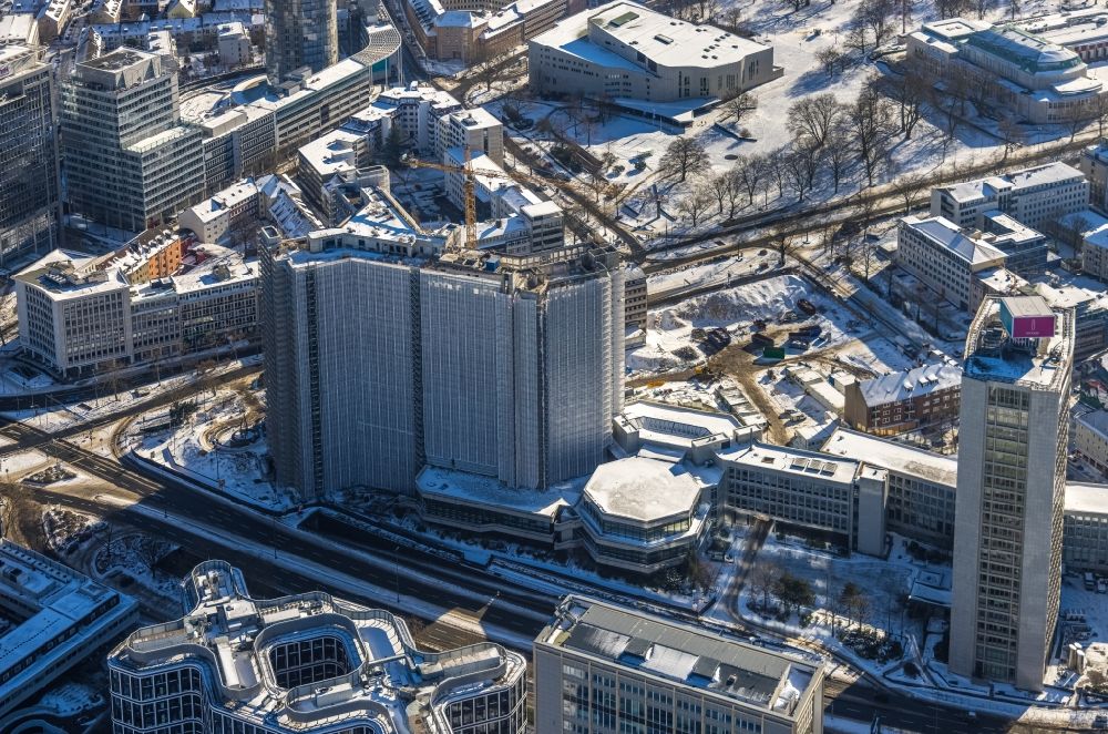 Aerial image Essen - Wintry snowy dismantling construction site to dismantle the high-rise building of the former RWE headquarters Ypsilon-Haus on Huyssenallee in the district Suedviertel in Essen in the Ruhr area in the state North Rhine-Westphalia, Germany