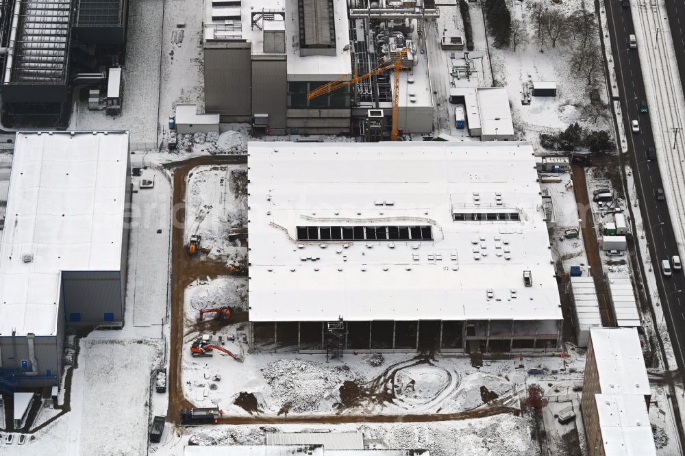Berlin from the bird's eye view: Wintry snowy demolition and dismantling of the disused old power plant hall of the thermal power plant on Rhinstrasse in the Marzahn district in Berlin, Germany
