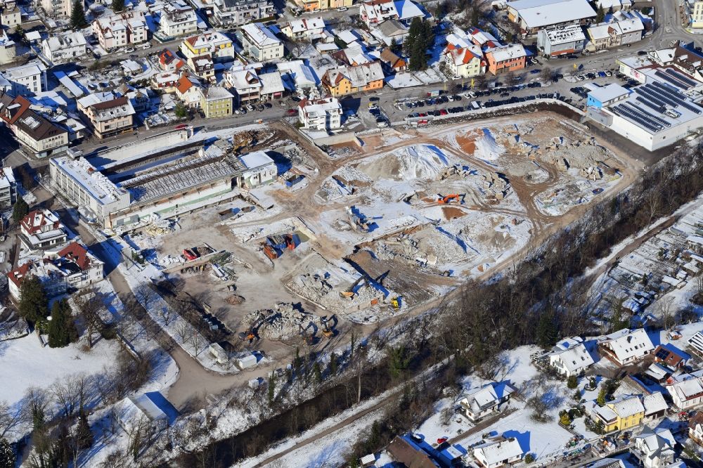 Wehr from the bird's eye view: Wintry snowy demolition work on the site of the Industry- ruins Brennet Areal in Wehr in the state Baden-Wuerttemberg, Germany