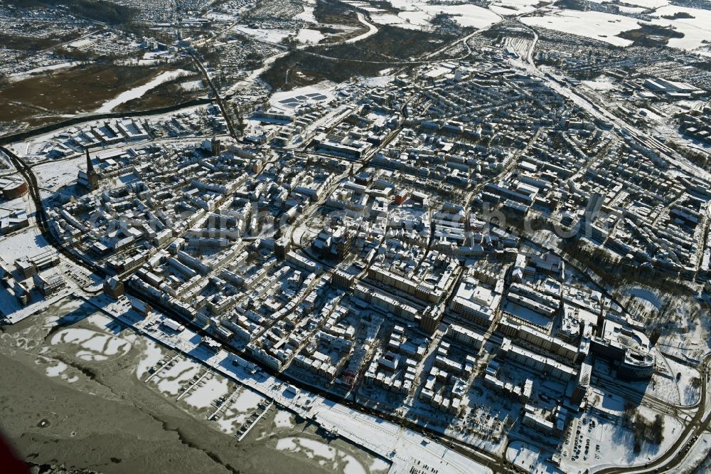 Rostock from above - Wintry snowy old Town area and city center on shore of Unterwarnow in Rostock in the state Mecklenburg - Western Pomerania, Germany
