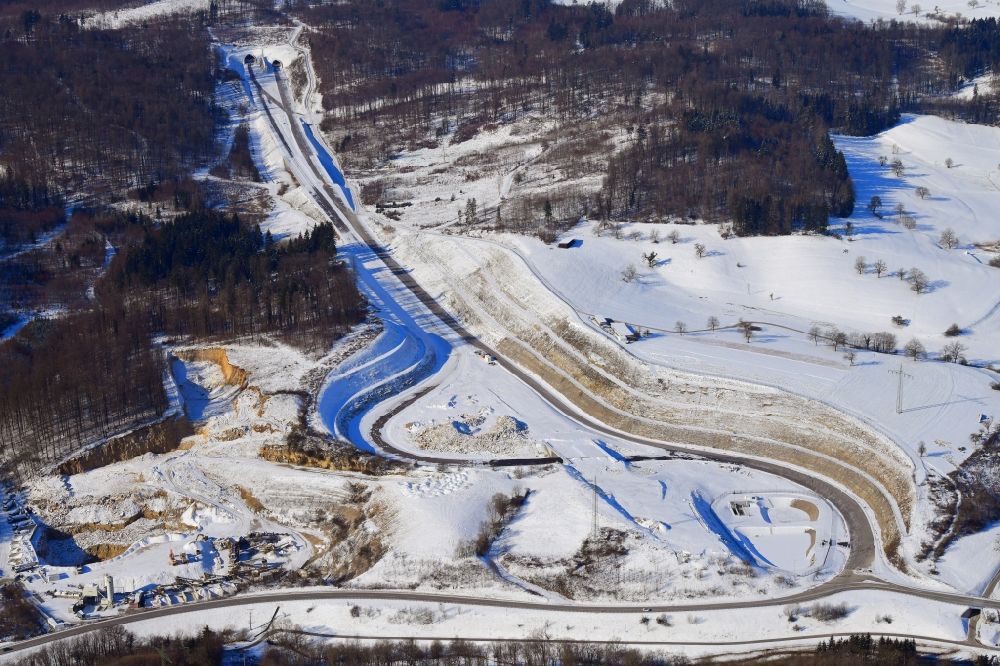 Aerial photograph Rheinfelden (Baden) - Wintry snowy highway- construction site with earthworks along the route of the highway A98 at the junction Rheinfelden-East in Rheinfelden (Baden) in the state Baden-Wurttemberg, Germany