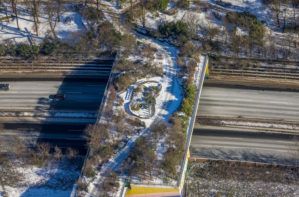 Aerial photograph Duisburg - Wintry snowy Bridge of a wildlife bridge designed as a green bridge - wildlife crossing bridge over the motorway BAB A3 in the district Duissern in Duisburg in the state North Rhine-Westphalia, Germany