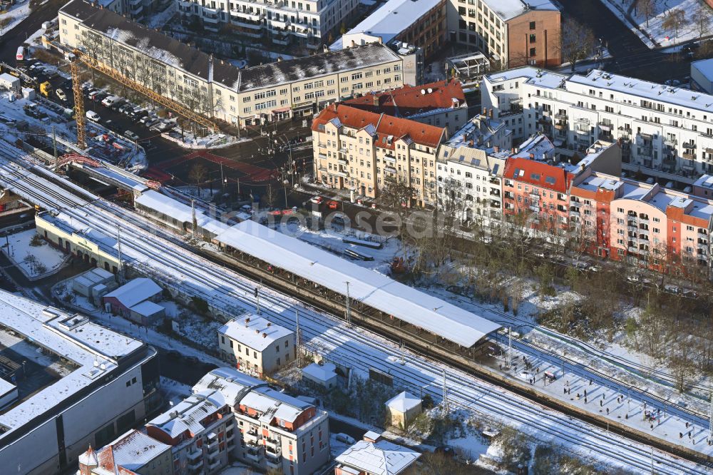 Aerial photograph Berlin - Wintry snowy station building and track systems of the S-Bahn station on street Bahnhofstrasse in the district Koepenick in Berlin, Germany