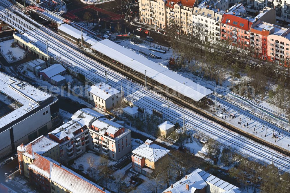Berlin from above - Wintry snowy station building and track systems of the S-Bahn station on street Bahnhofstrasse in the district Koepenick in Berlin, Germany