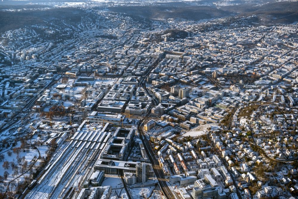 Aerial image Stuttgart - Wintry snowy building of the main station of the railway and construction site for the development project Stuttgart 21 in Stuttgart in the state of Baden-Wurttemberg