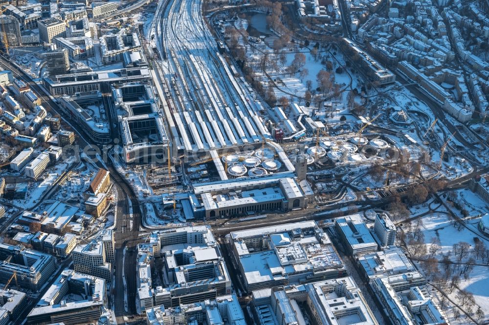 Stuttgart from above - Wintry snowy building of the main station of the railway and construction site for the development project Stuttgart 21 in the district Stadtzentrum in Stuttgart in the state of Baden-Wurttemberg