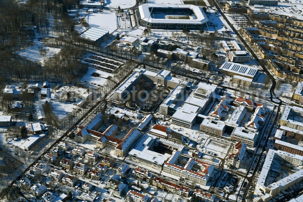 Rostock from the bird's eye view: Wintry snowy construction site company Schaelerbau for the new building of a functional building at the Campus Schillingallee in the district Hansaviertel in Rostock in the state Mecklenburg - Western Pomerania