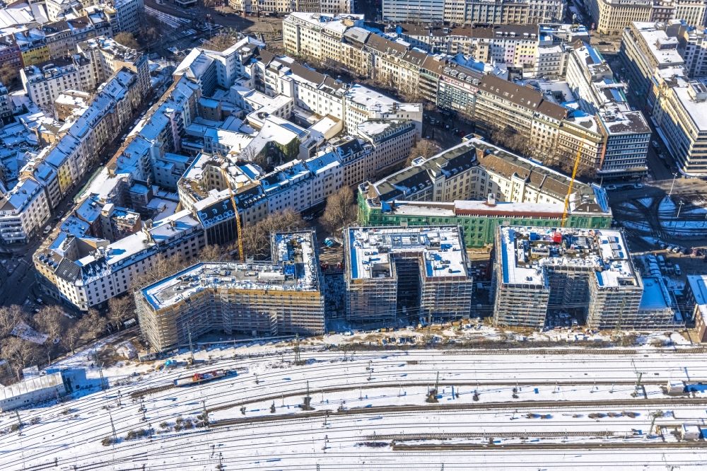 Düsseldorf from the bird's eye view: Wintry snowy new construction site the hotel complex on Harkortstrasse in Duesseldorf in the state North Rhine-Westphalia, Germany