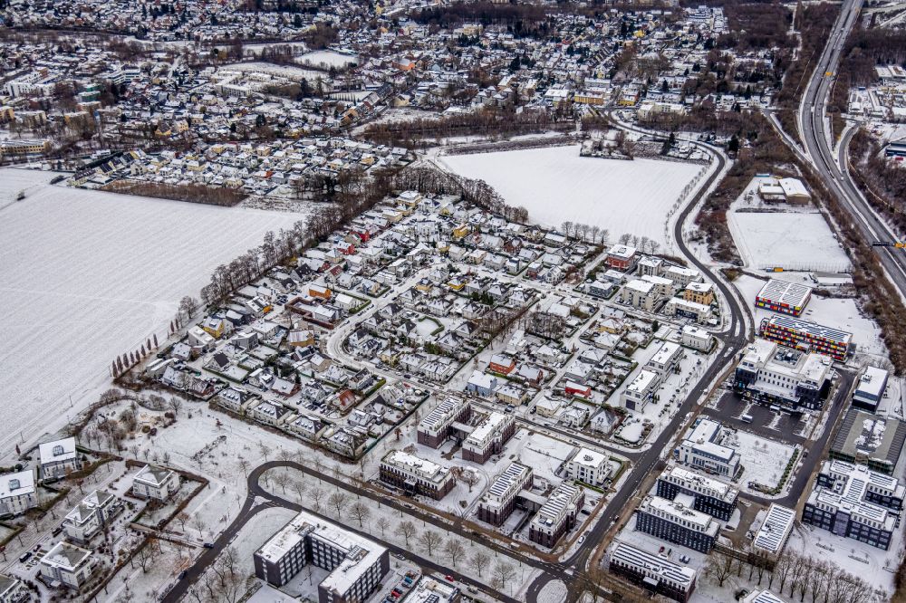 Aerial image Dortmund - Wintry snowy residential area construction site of a mixed development with multi-family houses and single-family houses- New building at the Lissaboner Allee - Londoner Bogen in Dortmund at Ruhrgebiet in the state North Rhine-Westphalia, Germany