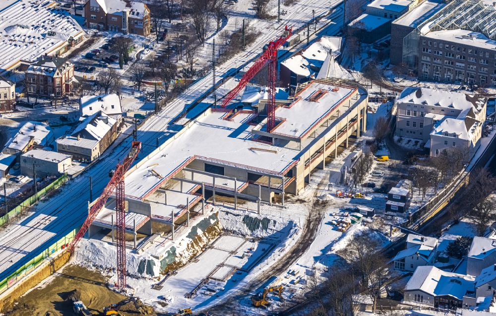 Unna from above - Wintry snowy New construction of the building complex of the shopping center on Bahnhofstrasse - Kantstrasse in the district Alte Heide in Unna at Ruhrgebiet in the state North Rhine-Westphalia, Germany