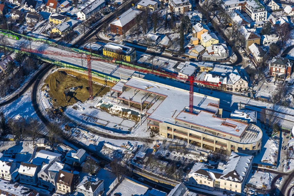 Aerial image Unna - Wintry snowy New construction of the building complex of the shopping center on Bahnhofstrasse - Kantstrasse in the district Alte Heide in Unna at Ruhrgebiet in the state North Rhine-Westphalia, Germany