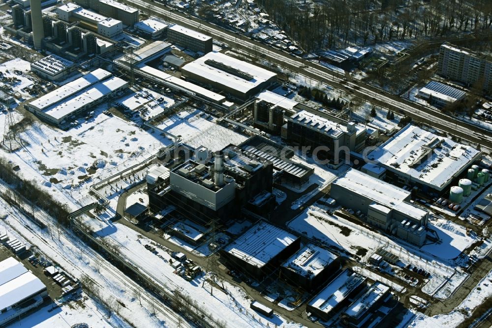 Berlin from the bird's eye view: Wintry snowy construction site of power plants and exhaust towers of thermal power station - Kraft-Waerme-Kopplungsanlage on Rhinstrasse in the district Marzahn in Berlin, Germany