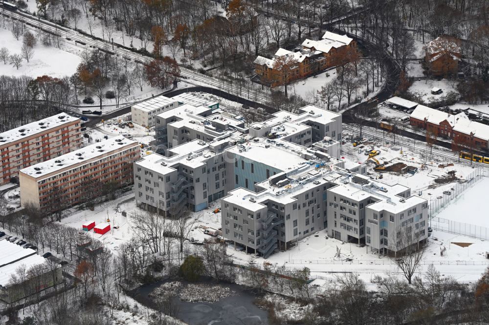 Aerial image Berlin - Wintry snowy new construction site of the school building on Allee of Kosmonauten in the district Lichtenberg in Berlin, Germany