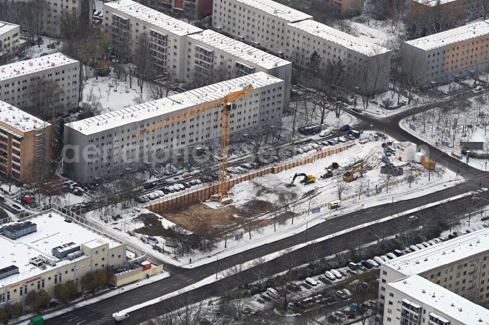 Berlin from above - Wintry snowy construction site for the new build retirement home Seniorenwohnen Cecilienstrasse on street Teterower Ring - Cecilienstrasse in the district Hellersdorf in Berlin, Germany