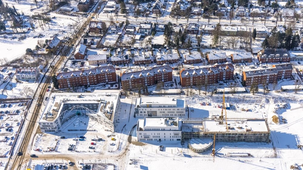 Aerial image Hamm - Wintry snowy construction site for the new multi-family housing development Paracelsuspark on Marker Allee in Hamm at Ruhrgebiet in the state of North Rhine-Westphalia
