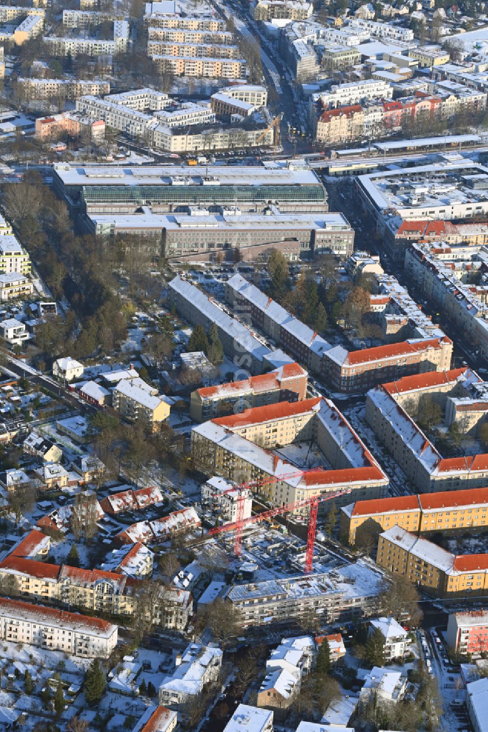 Aerial photograph Berlin - Wintry snowy construction site for the multi-family residential building COe Berlin on street Annenallee - Haemmerlingstrasse in the district Koepenick in Berlin, Germany