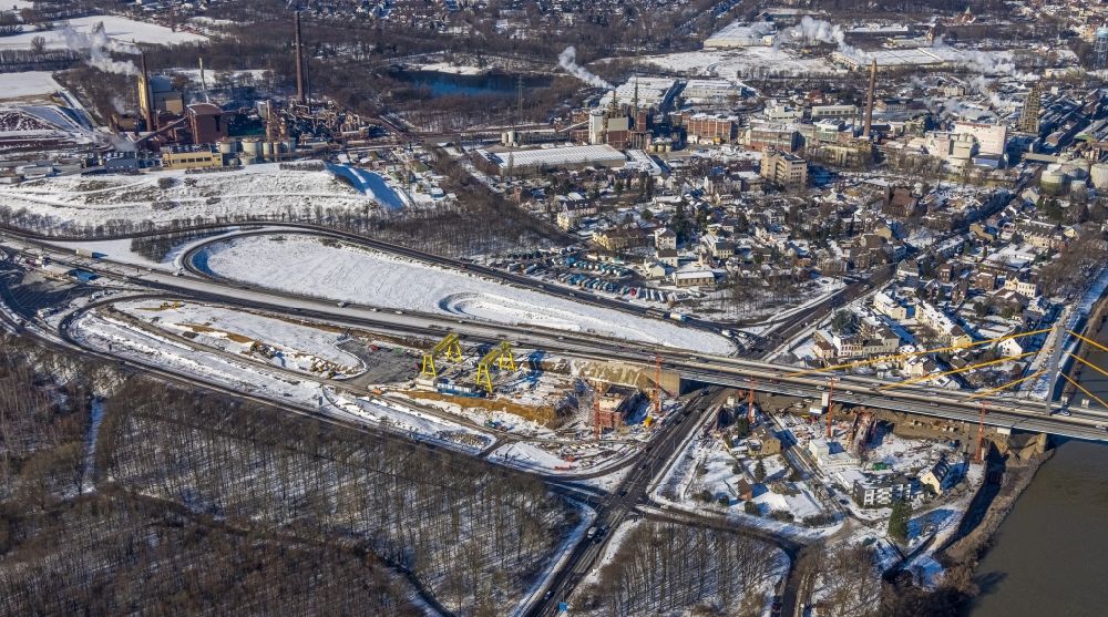 Aerial photograph Duisburg - Wintry snowy construction site for the rehabilitation and repair of the motorway bridge construction Rheinbruecke Duisburg-Neuenkamp in the district Kasslerfeld in Duisburg at Ruhrgebiet in the state North Rhine-Westphalia, Germany