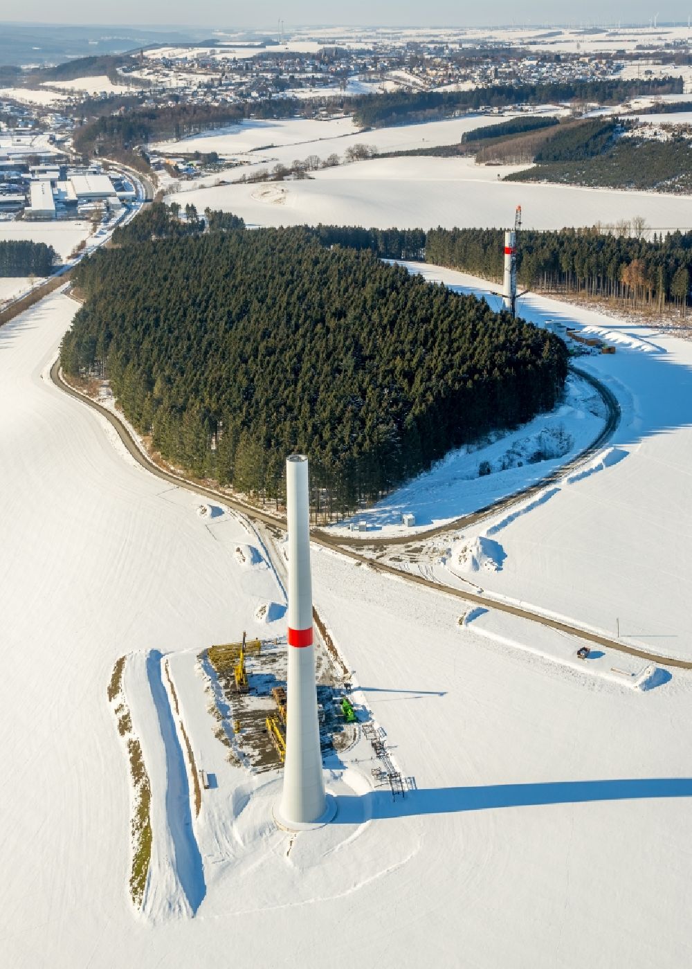 Aerial image Rüthen - Wintry snowy construction site for wind turbine installation in Ruethen in the state North Rhine-Westphalia