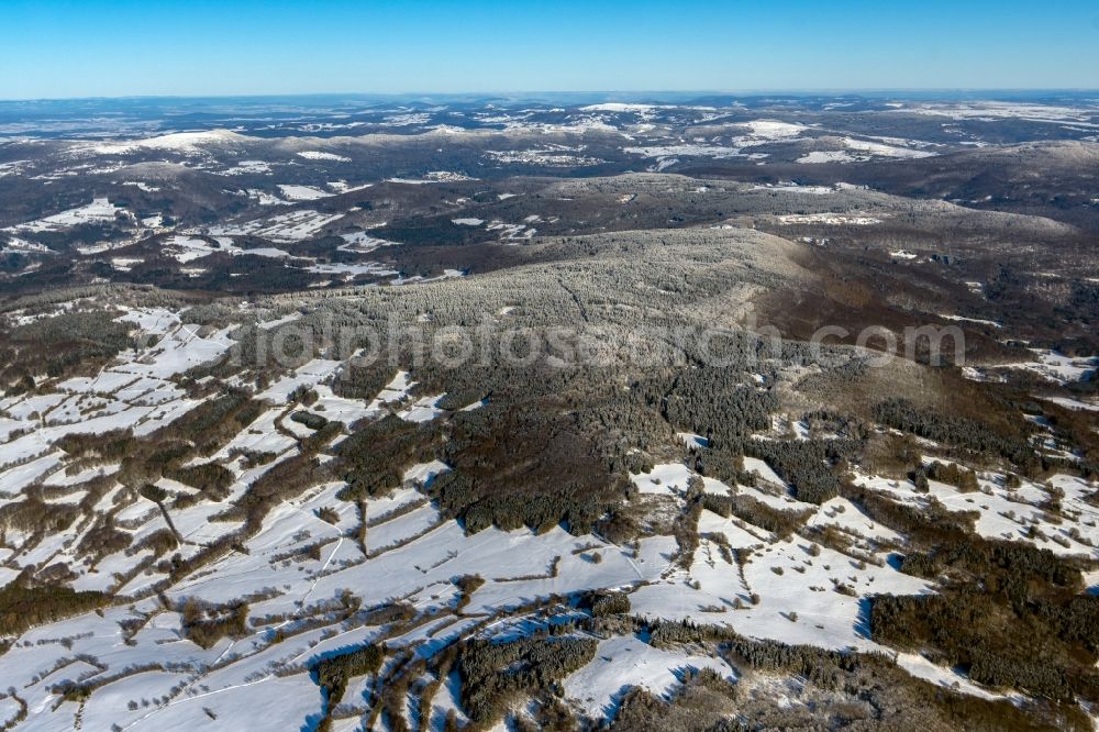 Aerial image Geroda - Wintry snowy mountain and valley landscape and Black Mountains in Geroda in the state Bavaria, Germany