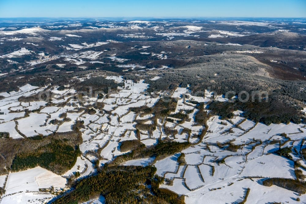 Geroda from above - Wintry snowy mountain and valley landscape and Black Mountains in Geroda in the state Bavaria, Germany