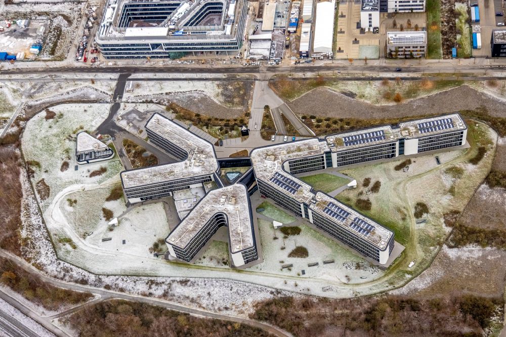 Dortmund from the bird's eye view: Wintry snowy office and commercial building of Amprion GmbH on Robert-Schuman-Strasse in the district Hoerde in Dortmund at Ruhrgebiet in the state North Rhine-Westphalia