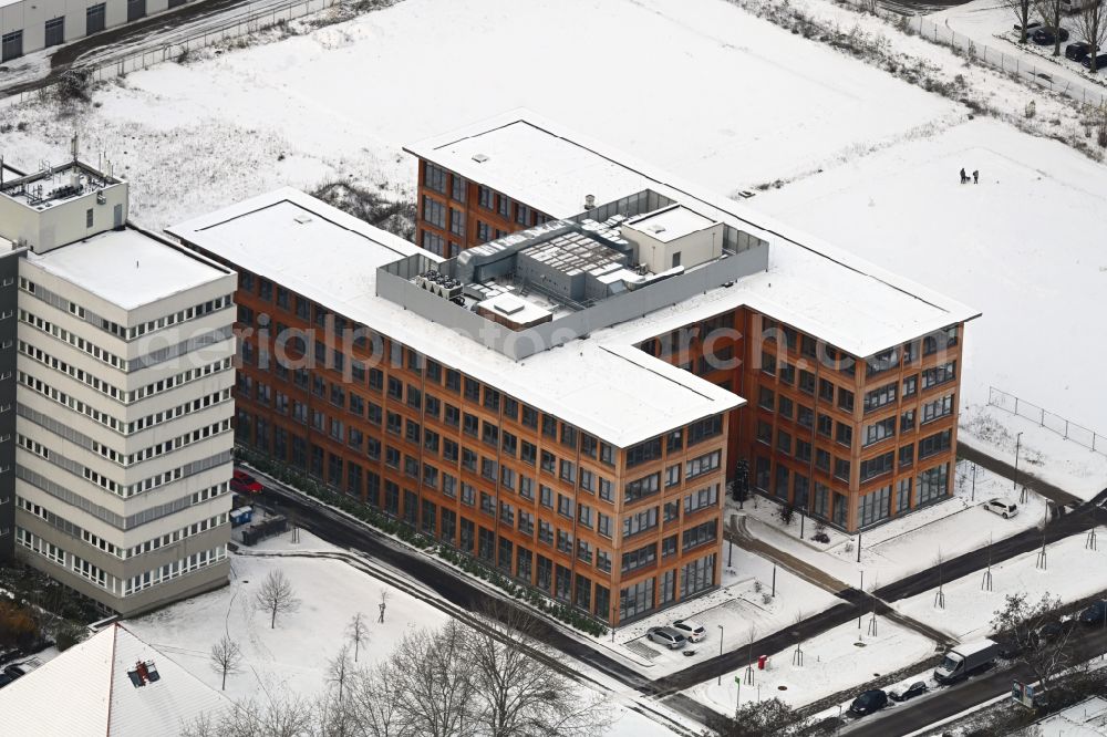 Aerial photograph Berlin - Wintry snowy office and commercial building on Beilsteiner Strasse in the district Marzahn in Berlin, Germany