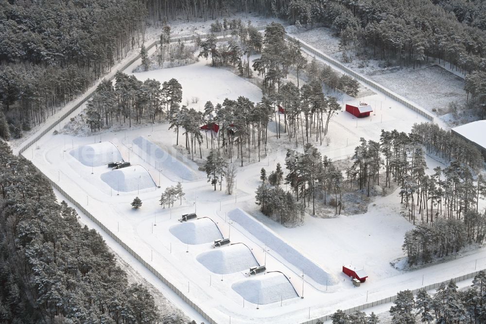Biesenthal from above - Wintry snowy bunker complex and munitions depot on the military training grounds the police on street Finower Chaussee in Biesenthal in the state Brandenburg, Germany