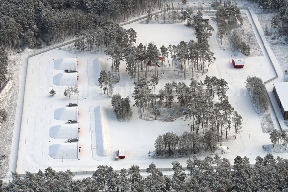 Biesenthal from the bird's eye view: Wintry snowy bunker complex and munitions depot on the military training grounds the police on street Finower Chaussee in Biesenthal in the state Brandenburg, Germany