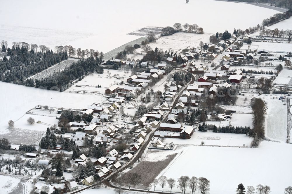 Danewitz from the bird's eye view: Wintry snowy village view in Danewitz in the state Brandenburg, Germany
