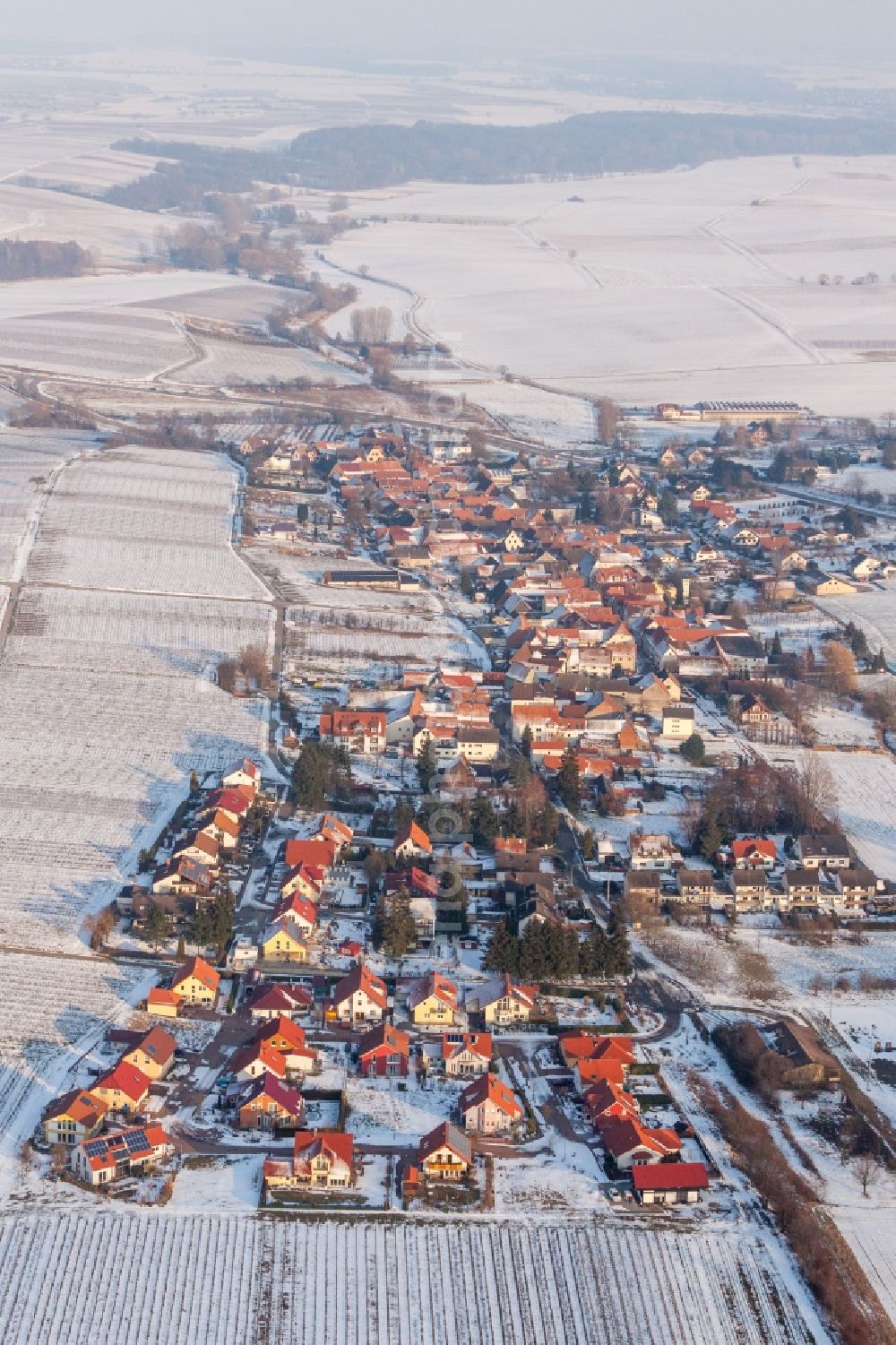 Aerial photograph Niederhorbach - Wintry snowy Village - view on the edge of agricultural fields and farmland in Niederhorbach in the state Rhineland-Palatinate, Germany