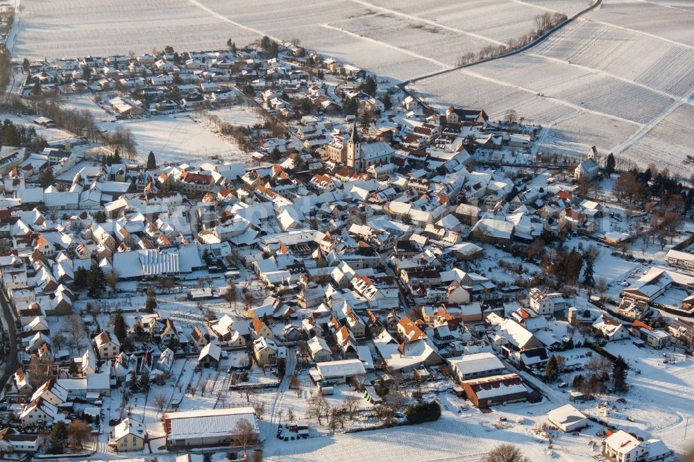 Landau in der Pfalz from the bird's eye view: Wintry snowy Village - view on the edge of agricultural fields and farmland in the district Moerzheim in Landau in der Pfalz in the state Rhineland-Palatinate, Germany