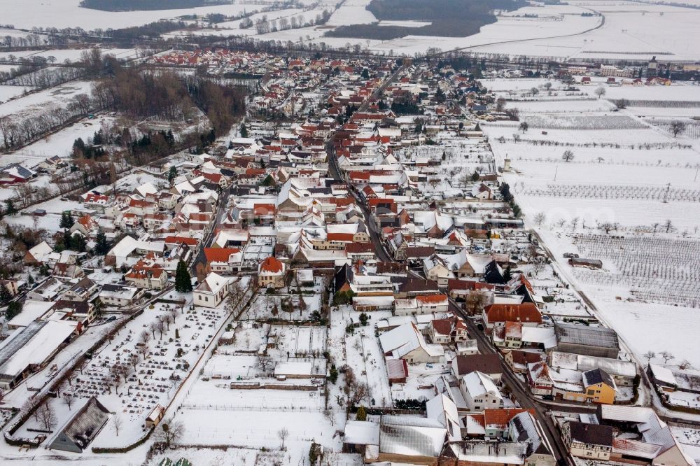 Aerial photograph Winden - Wintry snowy Village - view on the edge of agricultural fields and farmland in Winden in the state Rhineland-Palatinate, Germany