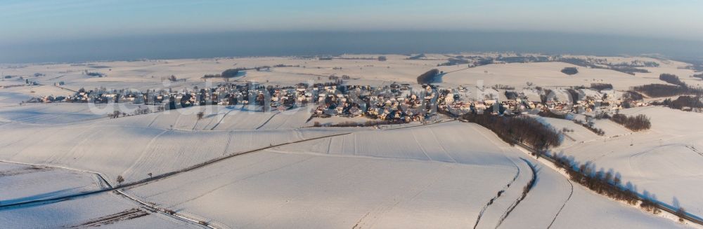 Wintzenbach from the bird's eye view: Wintry snowy Village - view on the edge of agricultural fields and farmland in Wintzenbach in Grand Est, France