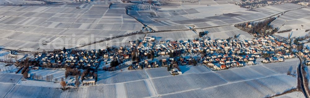Aerial image Wollmesheim - Wintry snowy Village - view on the edge of agricultural fields and farmland in Wollmesheim in the state Rhineland-Palatinate, Germany
