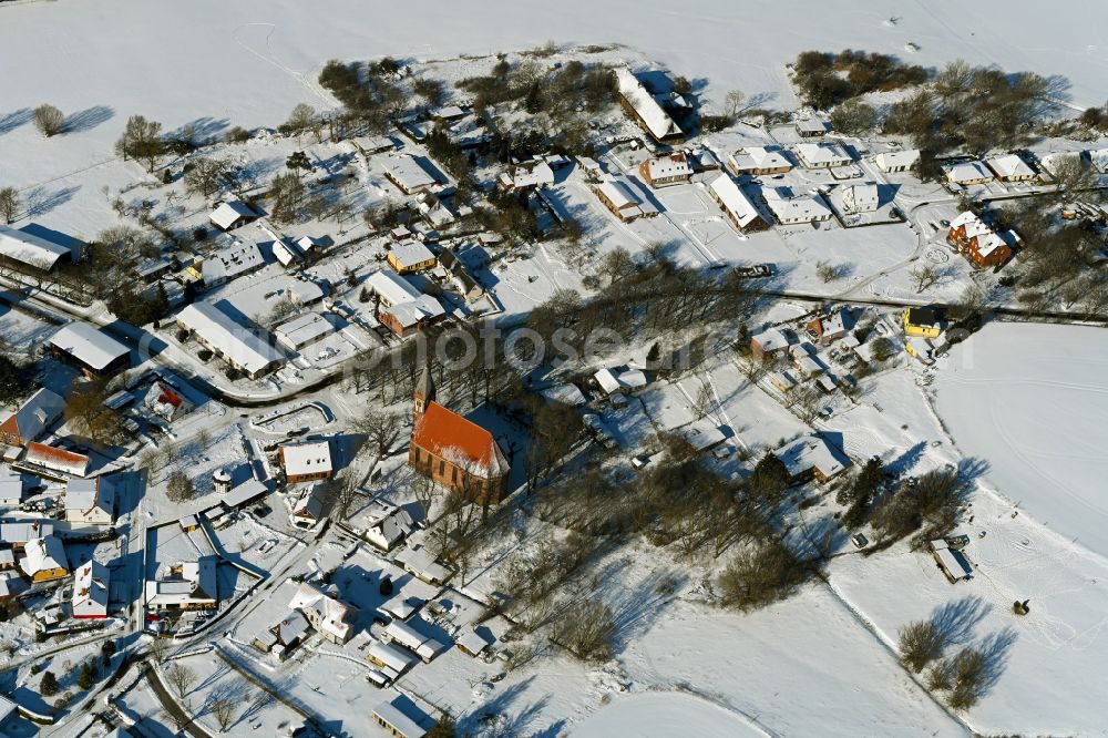 Aerial image Kenz - Wintry snowy agricultural land and field boundaries surround the settlement area of the village on street Kastanienallee in Kenz in the state Mecklenburg - Western Pomerania, Germany