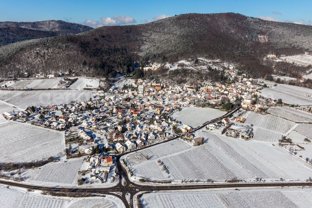 Aerial image Burrweiler - Wintry snowy village on the edge of vineyards and wineries in the wine-growing area Weinstrasse in Burrweiler in the state Rhineland-Palatinate, Germany