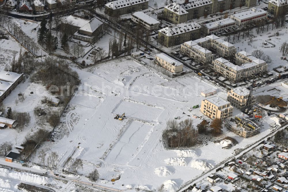 Aerial image Berlin - Wintry snowy development area of industrial wasteland Flugzeughallen Karlshorst on Biesenhorster Weg - Karlshorster Weg in the district Karlshorst in Berlin