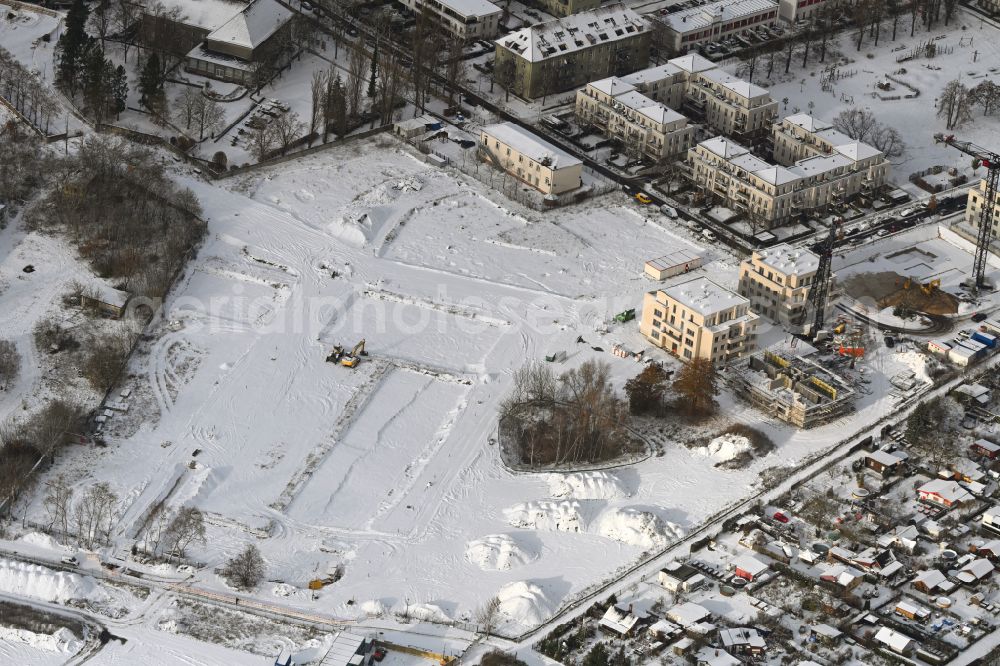 Aerial photograph Berlin - Wintry snowy development area of industrial wasteland Flugzeughallen Karlshorst on Biesenhorster Weg - Karlshorster Weg in the district Karlshorst in Berlin