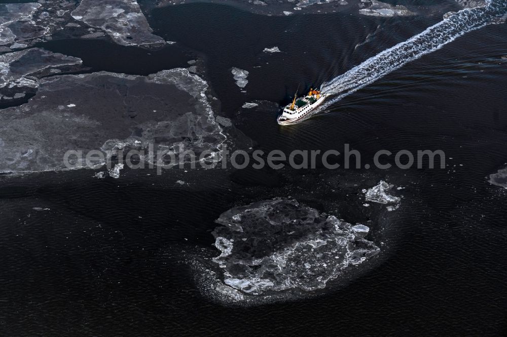 Aerial image Juist - Winter aerial view Journey of a ferry ship Frisia X between floating ice floes in front of the North Sea island of Juist in the state of Lower Saxony, Germany