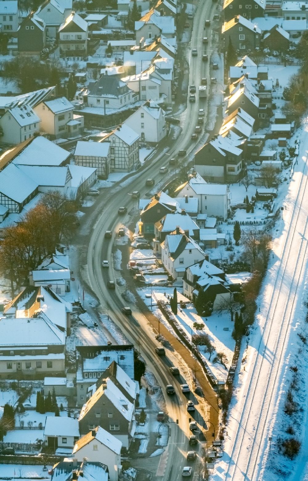 Bestwig from the bird's eye view: Wintry snowy Motor vehicles in traffic along the federal street B7 in the district Velmede in Bestwig in the state North Rhine-Westphalia