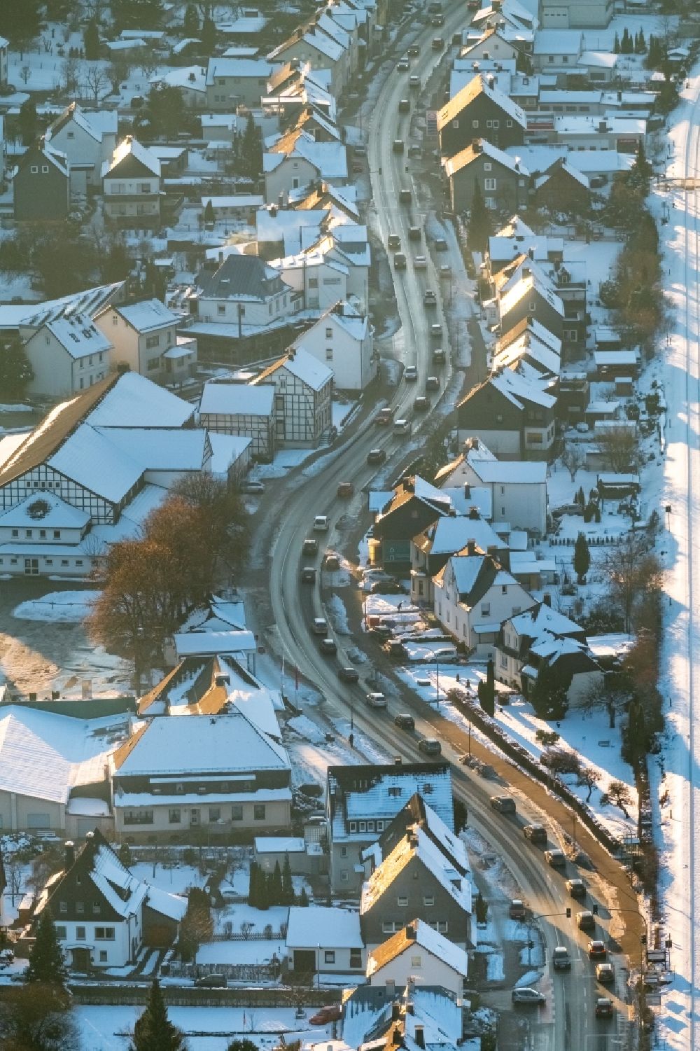 Aerial image Bestwig - Wintry snowy Motor vehicles in traffic along the federal street B7 in the district Velmede in Bestwig in the state North Rhine-Westphalia