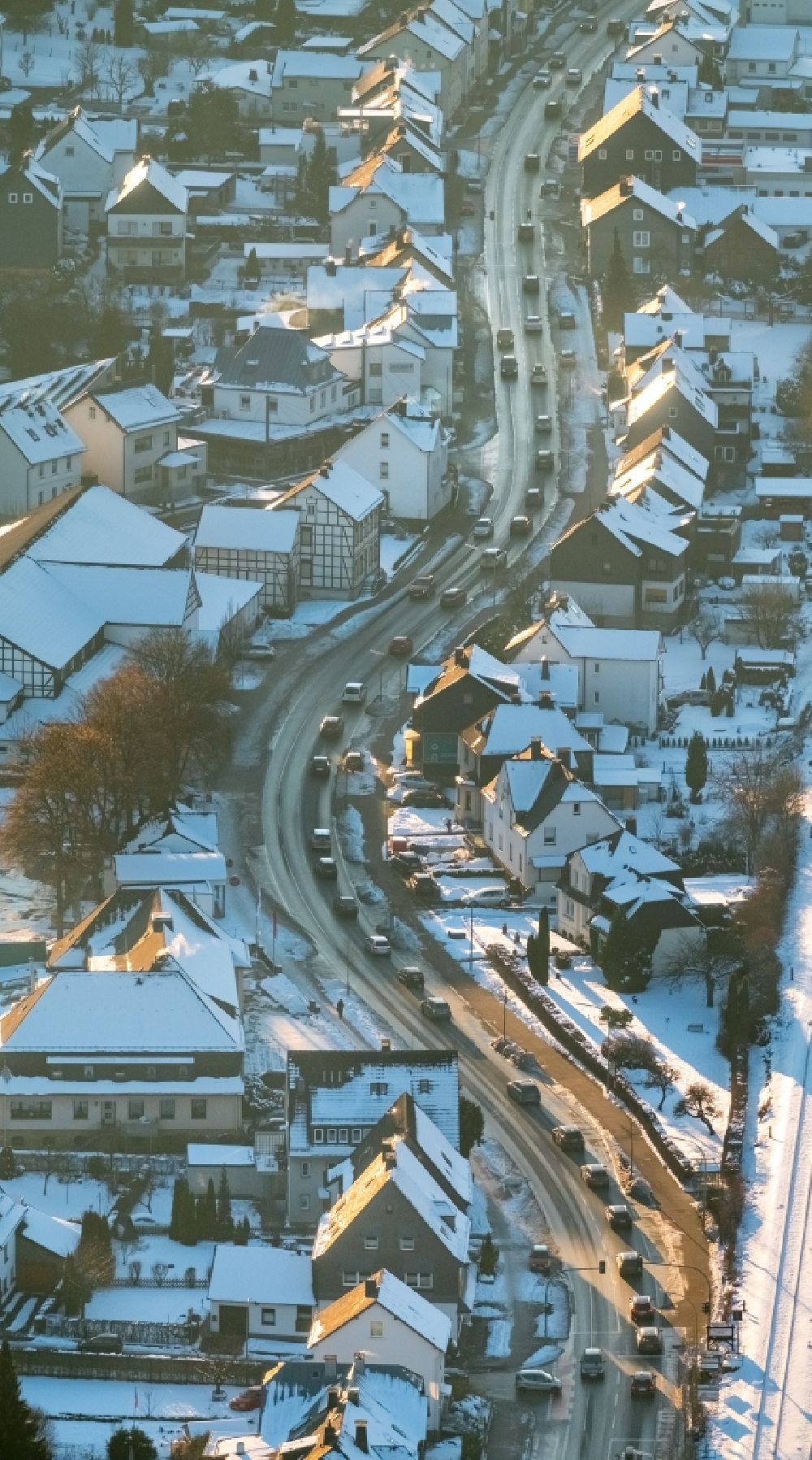 Aerial photograph Bestwig - Wintry snowy Motor vehicles in traffic along the federal street B7 in the district Velmede in Bestwig in the state North Rhine-Westphalia