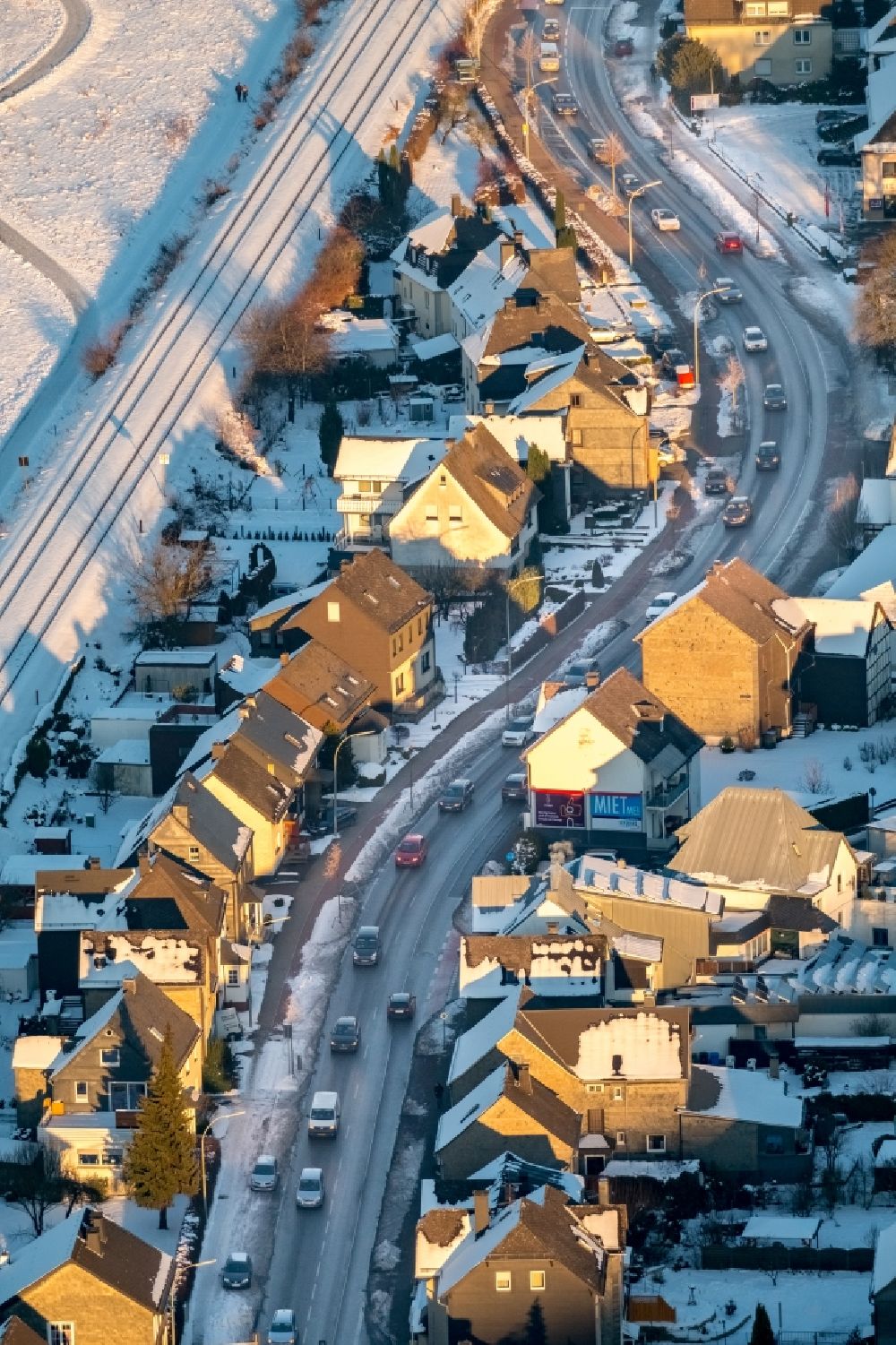 Aerial photograph Bestwig - Wintry snowy Motor vehicles in traffic along the federal street B7 in the district Velmede in Bestwig in the state North Rhine-Westphalia