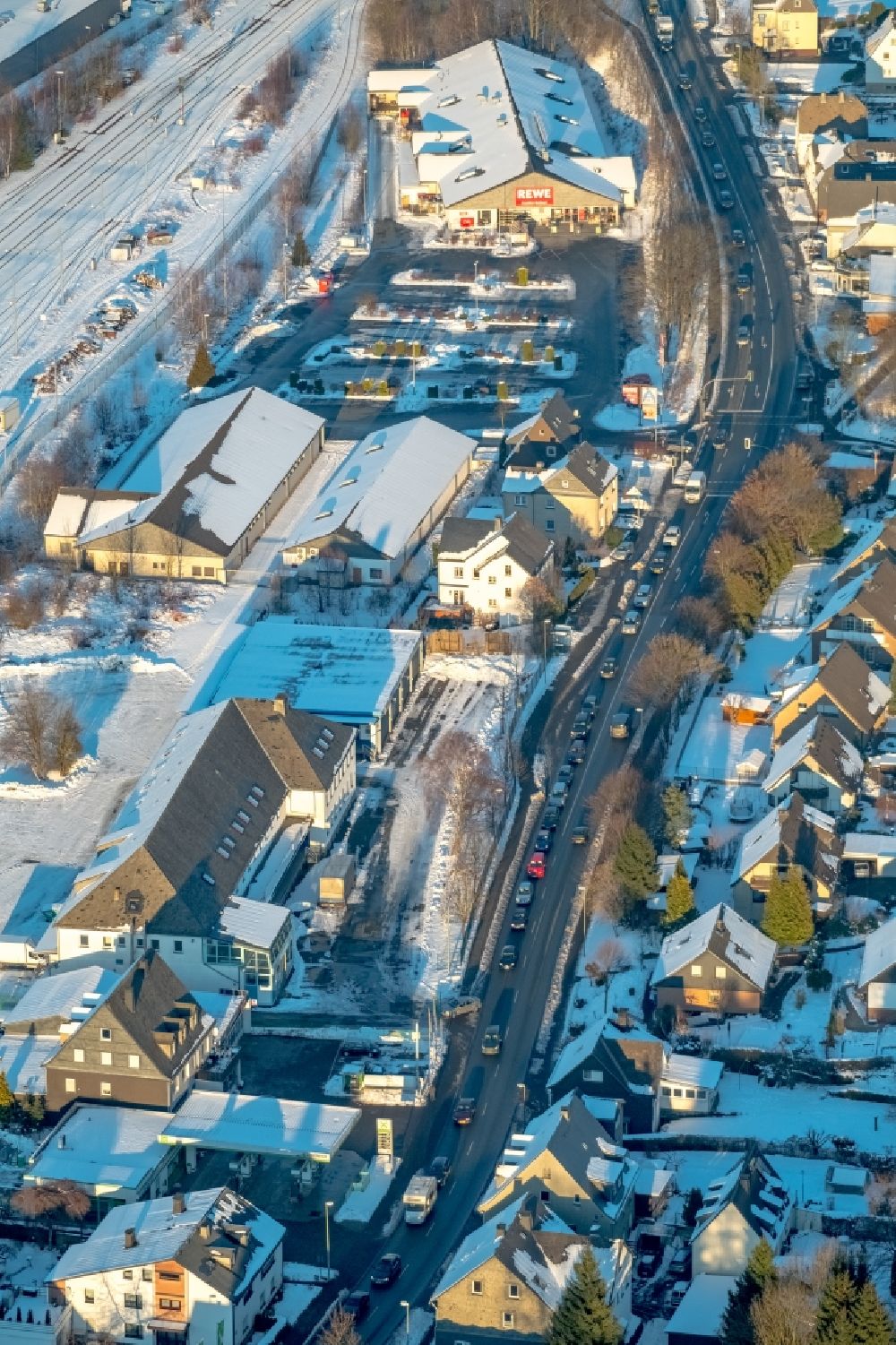 Bestwig from above - Wintry snowy Motor vehicles in traffic along the federal street B7 in the district Velmede in Bestwig in the state North Rhine-Westphalia