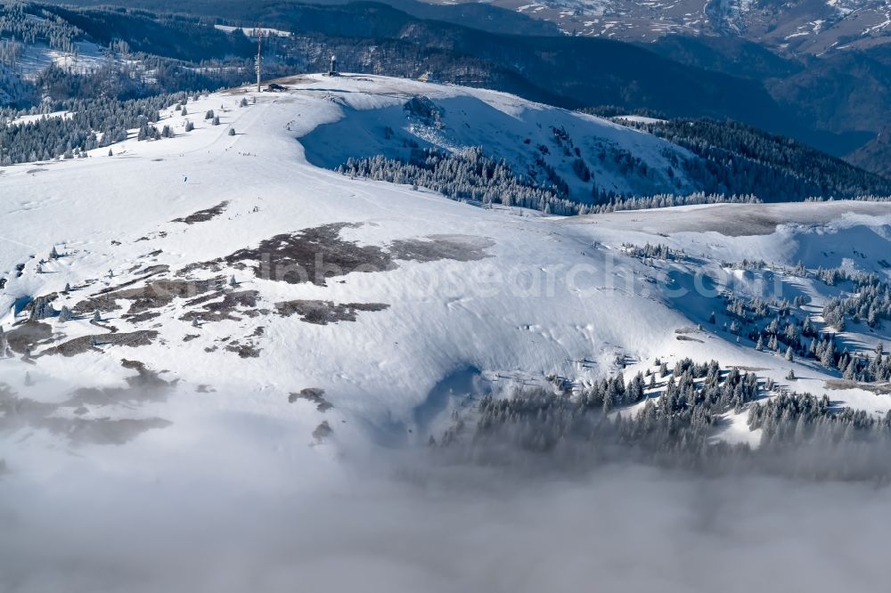 Feldberg (Schwarzwald) from above - Wintry snowy Rock and mountain landscape and Lifts in ski resort in Feldberg (Schwarzwald) in the state Baden-Wuerttemberg, Germany