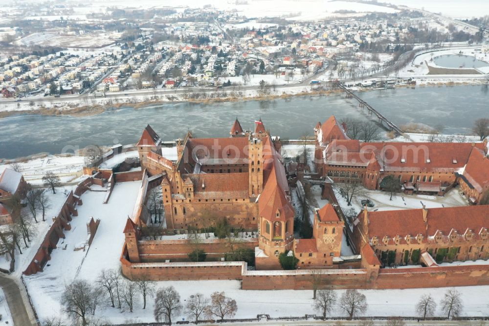 Malbork Marienburg from above - Wintry snowy fortress of Ordensburg Marienburg in Malbork Marienburg in Pomorskie, Poland in winter