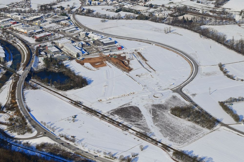 Aerial photograph Lörrach - Wintry snowy open landscape and construction works of the new hospital of the administrative district Loerrach in the district Hauingen in Loerrach in the state Baden-Wurttemberg, Germany