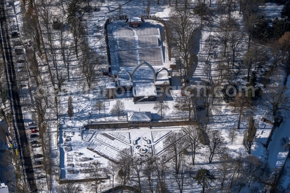 Marburg from the bird's eye view: Wintry snowy construction of the building of the open-air theater Schlossparkbuehne Marburg in Marburg in the state Hesse, Germany