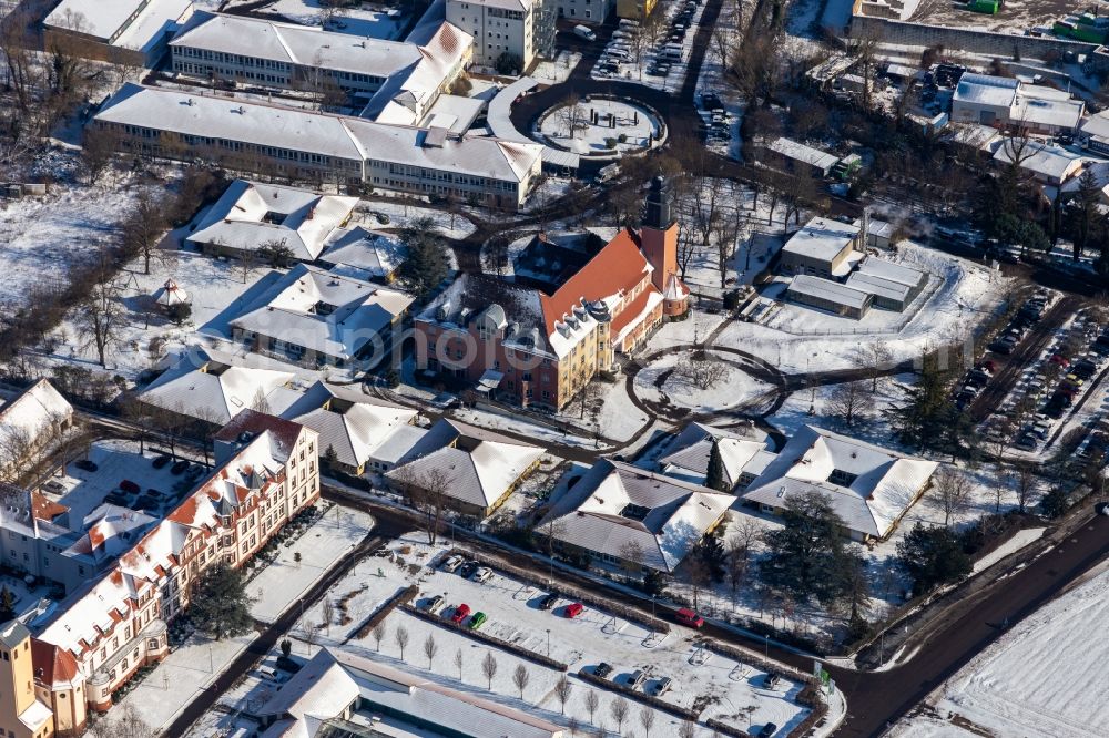 Aerial photograph Landau in der Pfalz - Wintry snowy buildings of the Childrens and Youth Home Jugendwerk St. Josef in the district Queichheim in Landau in der Pfalz in the state Rhineland-Palatinate, Germany